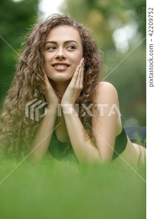 curly beautiful smiling woman 42209752