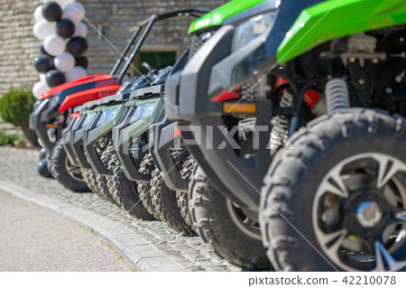 parked in a row several atv quad bikes extreme outdoor adventure concept 42210078