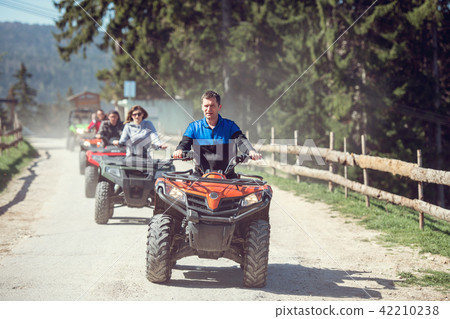 man riding atv vehicle on off road track ,people outdoor sport activitiies theme 42210238