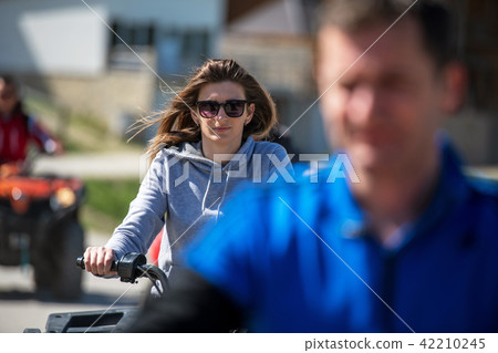 man riding atv vehicle on off road track ,people outdoor sport activitiies theme man riding atv vehicle on off road track ,people outdoor sport activitiies theme 42210245