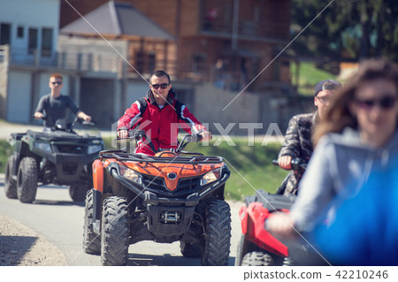 man riding atv vehicle on off road track ,people outdoor sport activitiies theme man riding atv vehicle on off road track ,people outdoor sport activitiies theme 42210246
