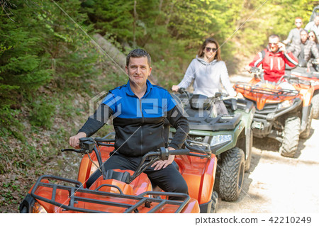 man riding atv vehicle on off road track ,people outdoor sport activitiies theme 42210249