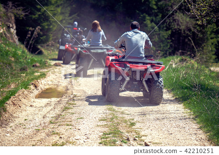 man riding atv vehicle on off road track ,people outdoor sport activitiies theme 42210251