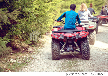 man riding atv vehicle on off road track ,people outdoor sport activitiies theme 42210273