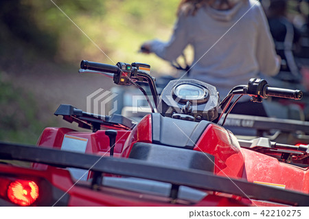 man riding atv vehicle on off road track ,people outdoor sport activitiies theme man riding atv vehicle on off road track ,people outdoor sport activitiies theme 42210275