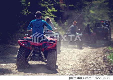 man riding atv vehicle on off road track ,people outdoor sport activitiies theme 42210279