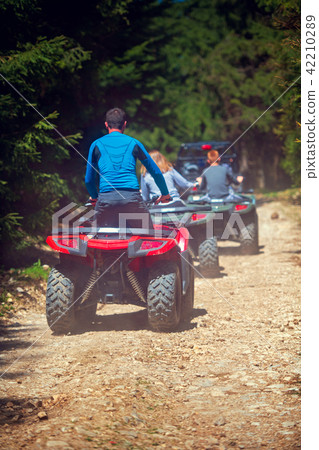 man riding atv vehicle on off road track ,people outdoor sport activitiies theme 42210289