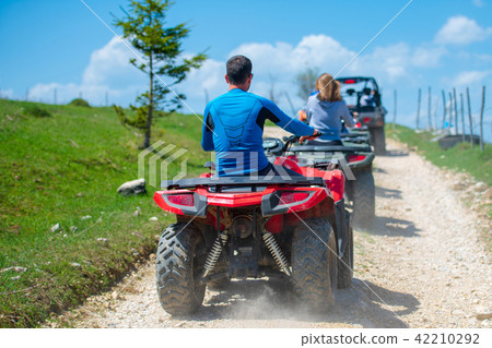 man riding atv vehicle on off road track ,people outdoor sport activitiies theme 42210292