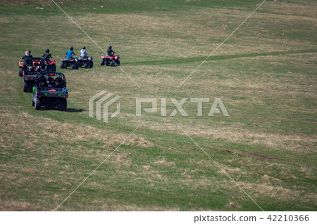 man riding atv vehicle on off road track ,people outdoor sport activitiies theme 42210366