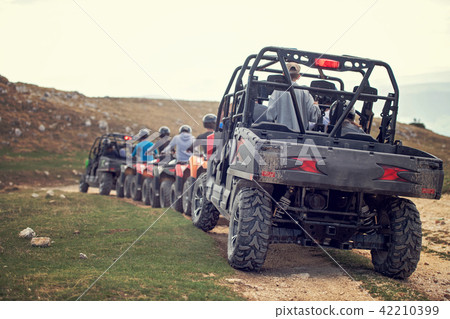 man riding atv vehicle on off road track ,people outdoor sport activitiies theme 42210399