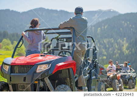 man riding atv vehicle on off road track ,people outdoor sport activitiies theme man riding atv vehicle on off road track ,people outdoor sport activitiies theme 42210443