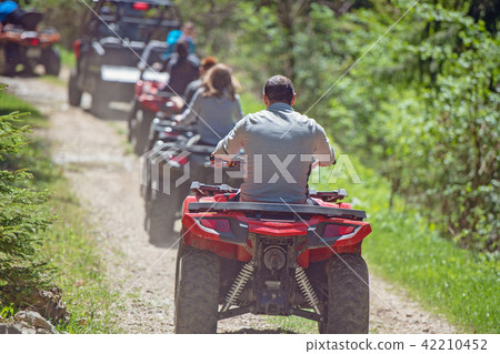man riding atv vehicle on off road track ,people outdoor sport activitiies theme 42210452