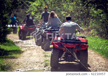 man riding atv vehicle on off road track ,people outdoor sport activitiies theme 42210457