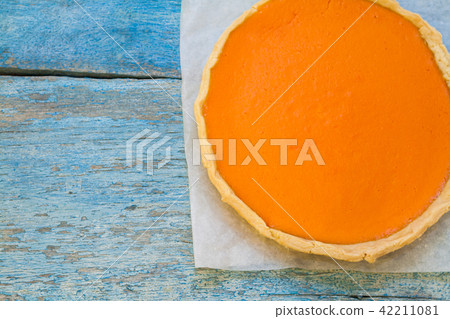 Bright pumpkin tart, flan, in the context of cream Bright pumpkin tart, flan, in the context of cream 42211081