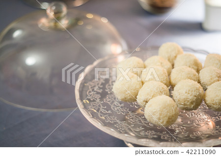 Cakes with coconut truffles in the evening light Cakes with coconut truffles in the evening light 42211090