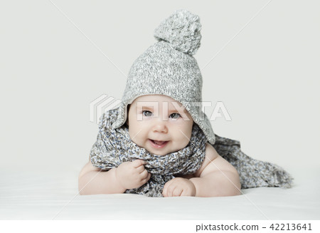 Cute small baby in knitted hat, portrait. Cute small baby in knitted hat, portrait. 42213641