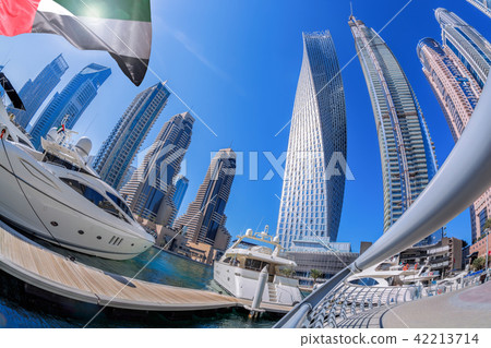 Dubai Marina with boats in Dubai, UAE Dubai Marina with boats in Dubai, UAE 42213714