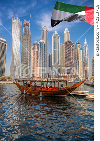 Dubai Marina with boats in Dubai, UAE Dubai Marina with boats in Dubai, UAE 42213718