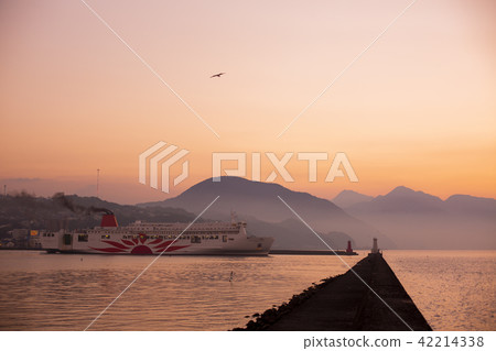 Ferry to sail out with sunset 42214338