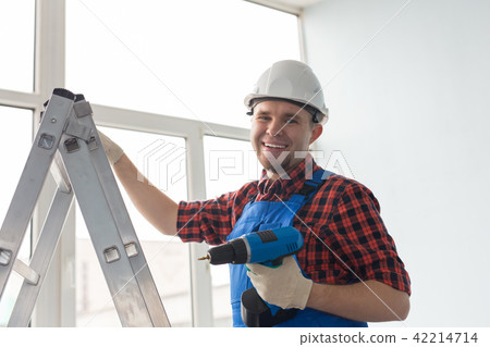 Construction worker in new house. Renovation concept Construction worker in new house. Renovation concept 42214714