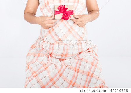 Pregnant women holding gift box Pregnant women holding gift box 42219768