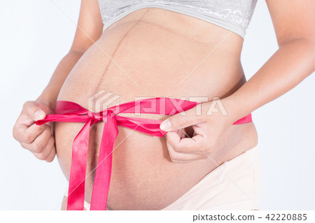 pregnant woman tied with a ribbon 42220885