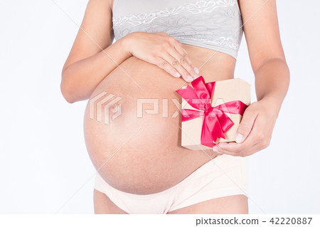 pregnant woman tied with a gift 42220887