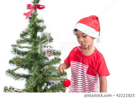 Cute little boy with decorating Christmas tree Cute little boy with decorating Christmas tree 42221025
