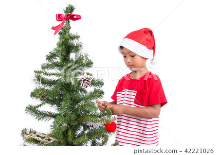 Cute little boy with decorating Christmas tree Cute little boy with decorating Christmas tree 42221026