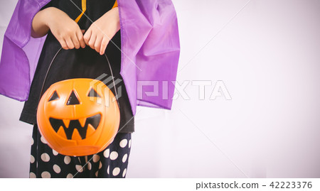 Beautiful girl witch with pumpkin Beautiful girl witch with pumpkin 42223376