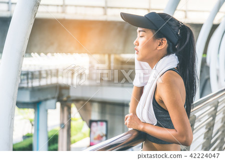 Woman is exercising in the city Woman is exercising in the city 42224047