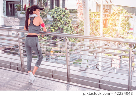 Woman is exercising in the city 42224048