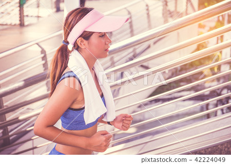 Woman is exercising in the city 42224049