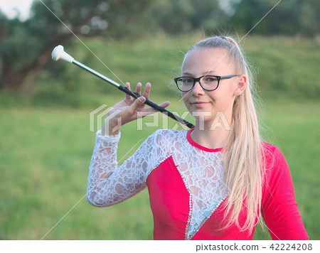 Teen Majorette Girl Twirling Baton Outdoors Teen Majorette Girl Twirling Baton Outdoors 42224208