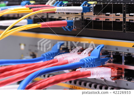 Fiber optic and network cables in data center Fiber optic and network cables in data center 42226933