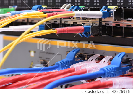 Fiber optic and network cables in data center Fiber optic and network cables in data center 42226936