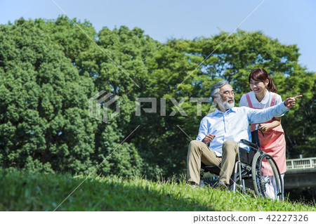 Nursing care senior female male helper caregiver 42227326
