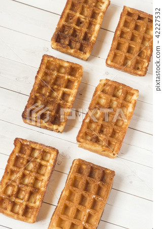 Homemade waffles on a light table. Selective focus Homemade waffles on a light table. Selective focus 42227532