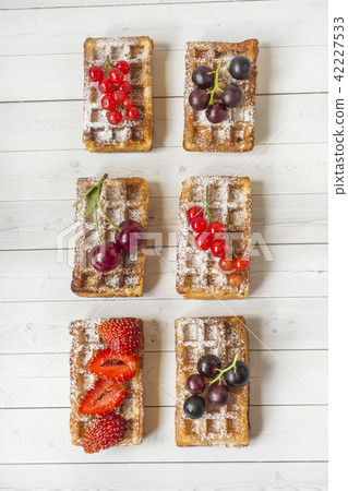Homemade waffles with summer berries  42227533