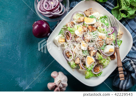 Caesar salad with chicken, eggs and croutons 42229543