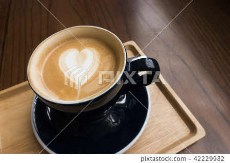 Latte on a wooden table 42229982