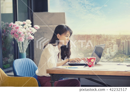 asian freelancer working on computer laptop 42232517