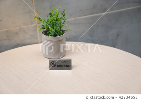 no smoking sign on light wooden table no smoking sign on light wooden table 42234655