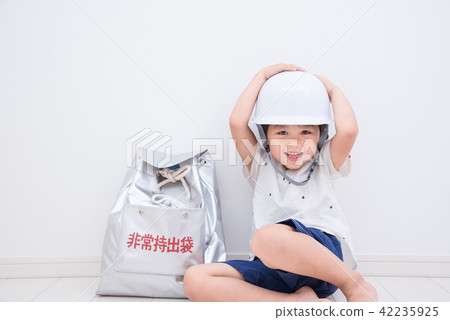 A boy wearing a helmet A boy wearing a helmet 42235925