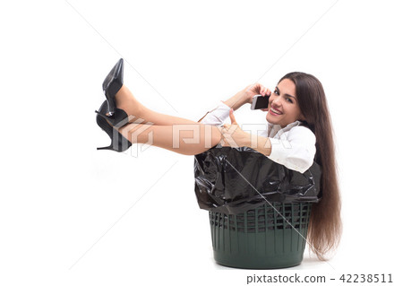 Crazy woman sitting in trash can. Crazy woman sitting in trash can. 42238511