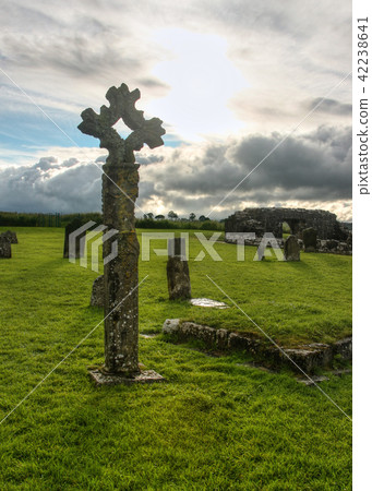 Old celtic stone cross on cemetery Old celtic stone cross on cemetery 42238641