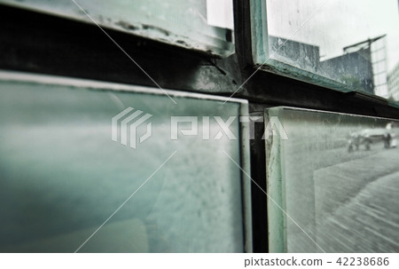 Abstract detail of dirty glass panes  42238686