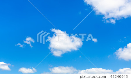 fluffy clouds in dark blue sky in sunny summer day 42240943