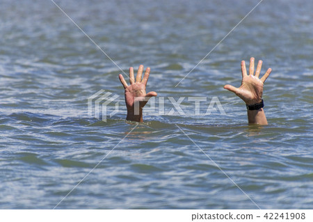 masculine hands sticks out of the sea water masculine hands sticks out of the sea water 42241908