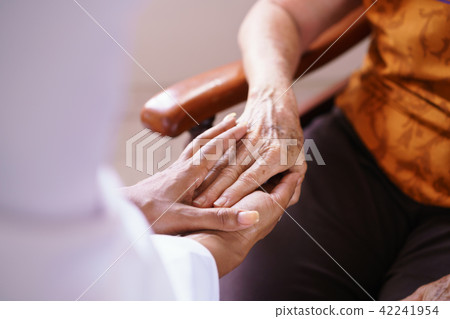 Doctor Vising Senior Woman In Old People Home 42241954